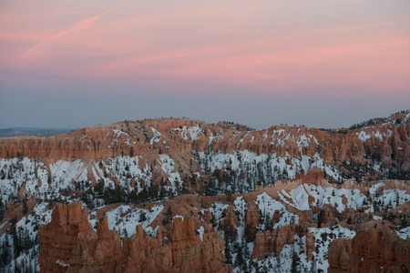 Faint Sunset Begins Over Snowy Bryce Canyonの写真素材