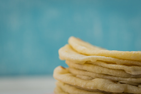 Detail on Homemade Tortillas with copy space over blue backgroundの写真素材