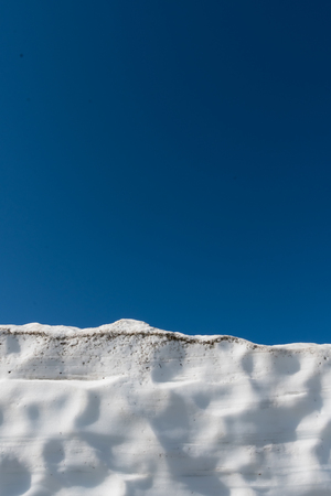 Snow Drift and Blue Sky vertical image with copy spaceの写真素材