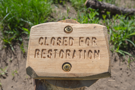 Closed For Restoration Sign in Wood along alpine meadowの写真素材