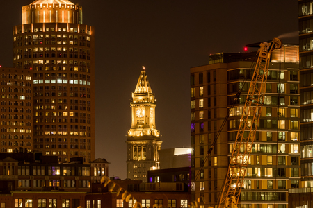 Custom House Tower Among Boston Skyline shines at nightの写真素材