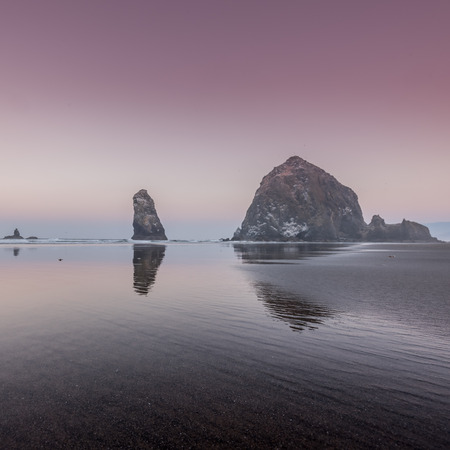 Pink Sunrise Over Haystack Rocks along Oregon coastの写真素材