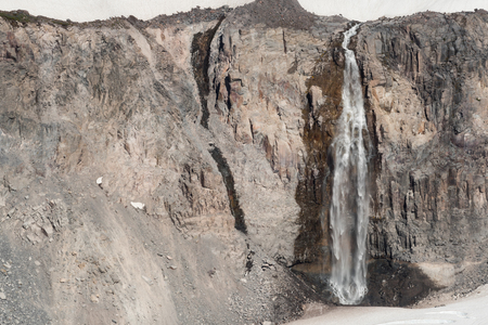 Waterfall Spilling Off Paradise Glacier under Mount Rainierの写真素材