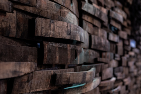 Narrow Focus of Bourbon Barrels on Wall from angle