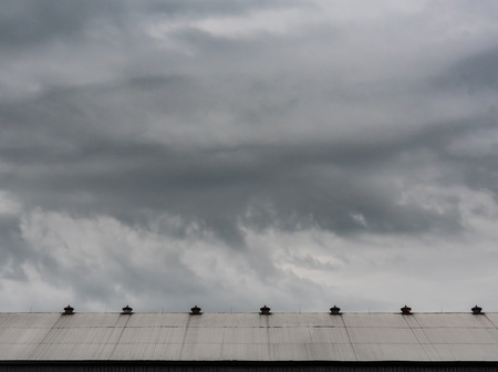 Storm Clouds Above Horse Barn Roof with copy spaceの写真素材
