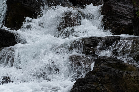 Water Rushes Over Rocks with fresh water high in Montana mountains