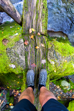 Manâs Feet On Moss Log Bridge In Great Smoky Mountainsの写真素材
