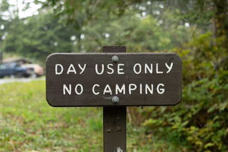 Day Use Only No Camping Sign at park rest areaの写真素材