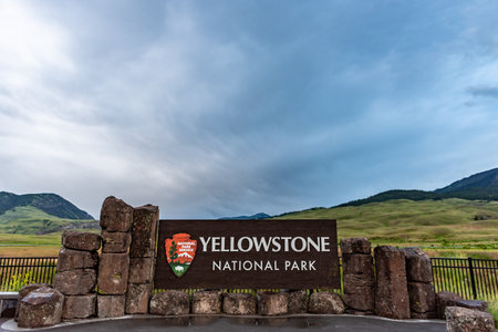 Gardiner, United States: June 23, 2018: Smooth Clouds Over Yellowstone Signのeditorial素材