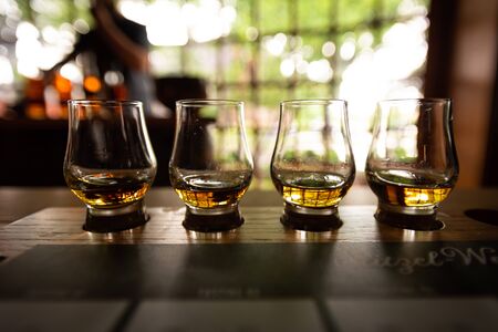 Bourbon Flight with selective focus on four samples