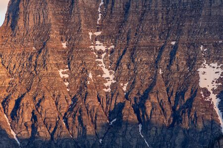 Snow Lingers on Red Mountain Slopes in Montana Mountain Range
