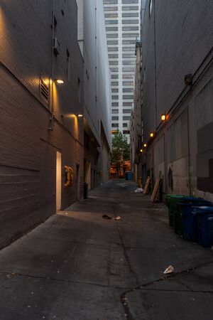 Alley Between Tall Buildings in Seattle, Washington on overcast dayの写真素材