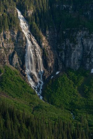 Birdwoman Falls Drops Into the Valley Below mountain cliffの写真素材