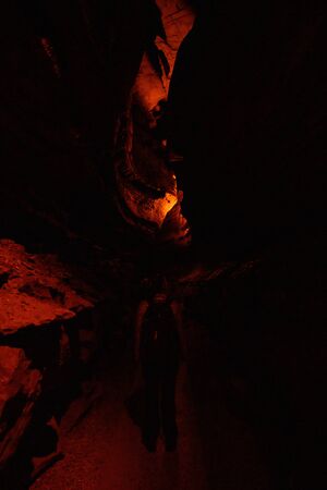 Dimly Light Cave Tunnel in Mammoth Cave through narrow passage