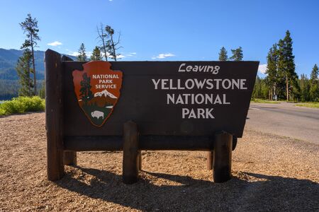 Yellowstone National Park, United States: July 16, 2019: Leaving Yellowstone Sign on the southern boundary of the popular parkの写真素材