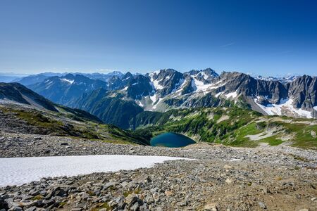 Looking Down on Lake and North Cascades Mountains in Washington wilderness