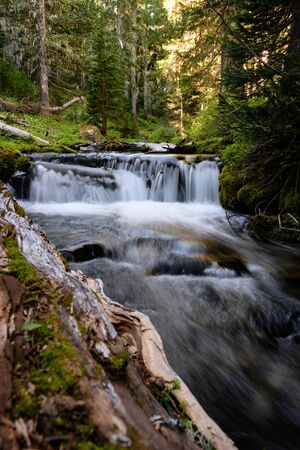 Water Streams over drop off in creek in summer