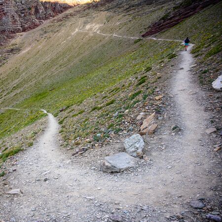 Hiker Passing  steep Switchback up to mountain overlook