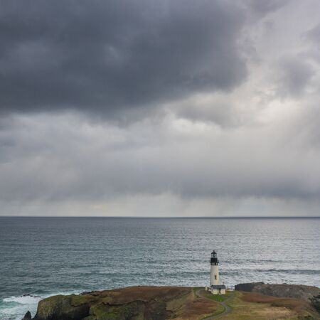 Storm Brews Above Yaquina Head Lighthouseの写真素材
