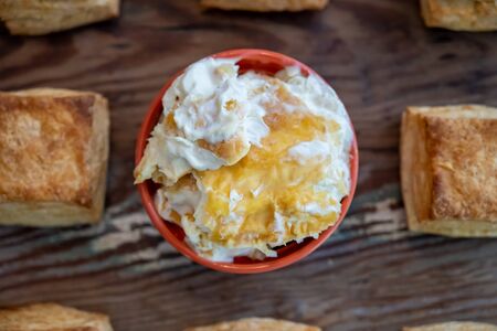 Looking Straight Down on Home Made Clotted Cream with biscuits
