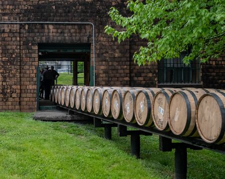 Versailles, United States: May 3, 2018: Barrels Roll through building at historic distillery on the...