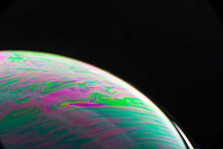 Brightly Colored Macro Bubble on Black Backgroundの写真素材