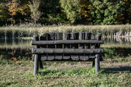 Wooden Bench at Cuyahoga Valley Lake on late afternoonの写真素材