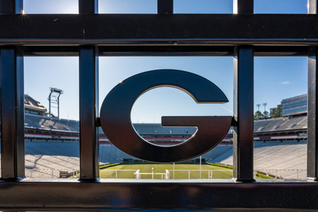 Athens, United States: April 11, 2020: Georgia Logo on Sanford Stadium Fence with empty stadium...