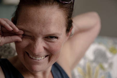 Woman Stretches and Smiles While Laughingの写真素材