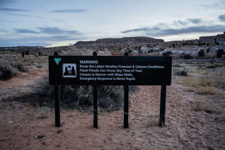Weather Warning Sign At Trailhead in Southern Utah that heads into a slot canyonの写真素材