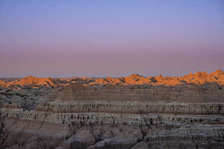 Blue Hour Light Over Badlands Formations in South Dakotaの写真素材