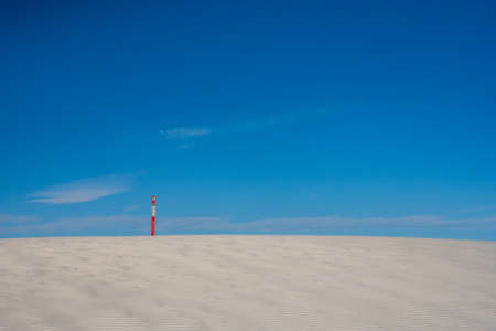 Trail Marker on Crest of Sand Dune in White Sands National Parkの写真素材