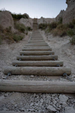 Close up on Rung of Wooden Labber Climbing Hoodoo in Badlandsの写真素材
