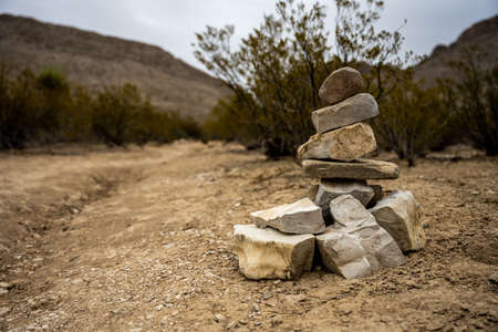 Stacked Rock Cairn On Side of Dirt Trail in Big Bend National Parkの写真素材