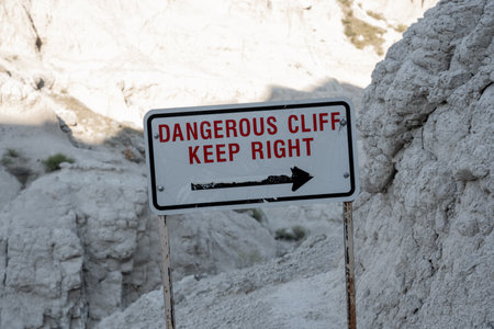 Dangerous Cliffs Sign in Badlandsの写真素材