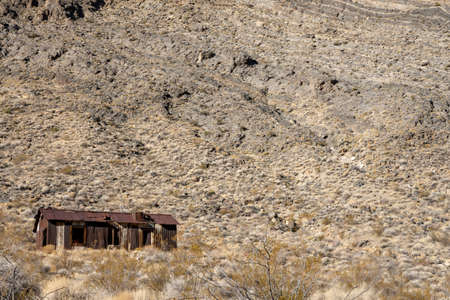 Barren Hillside And Single Building In Leadfield Ghost Town in Death Valley