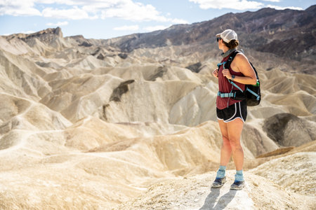 Woman Looks Back Toward Zabriskie Point in Death Valley National Parkの写真素材