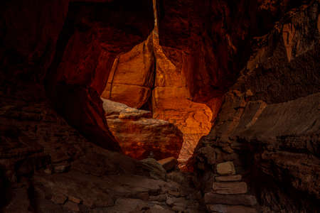 Cairns Lead The Way Through a Tunnel Along The Joint Trail in Canyonlands National Parkの写真素材