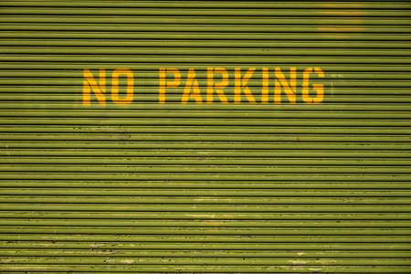 No Parking Block Letters On Top of Garage Doorの写真素材