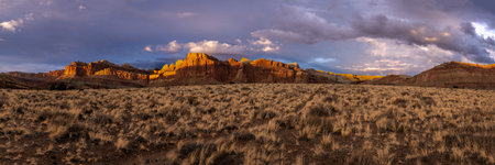 Panorama of Golden Grass and Red Cliffs in Capitol Reef National Parkの写真素材