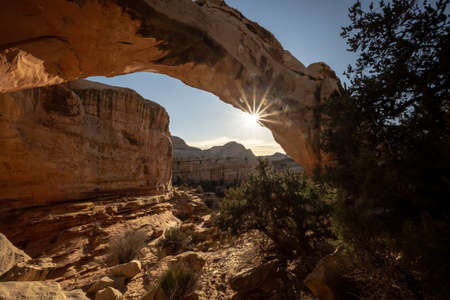 Sun Burst Through Hickman Bridge in Capitol Reef National Parkの写真素材