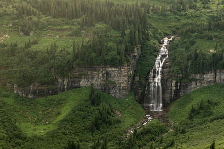 Unknown Waterfall Drops From Logan Pass Along Going To The Sun Road in Glacier National Parkの写真素材