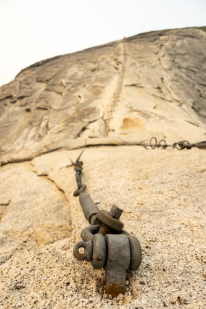 Metal Anchor Holds Tight To The Granite of Half Dome in Yosemite National Parkの写真素材