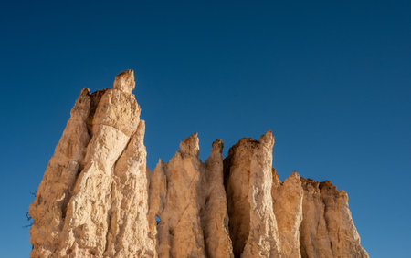 Top of Jagged Hoodoo Against Blue Sky in Bryce Canyon National Parkの写真素材