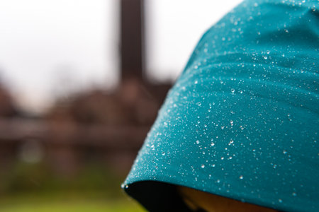 Rain Drops on Womanâs Hood with copy space to leftの写真素材