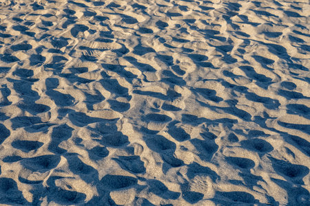 Shadows of Sandy Footprints over dune surface in Death Valley National Park