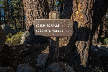 Yosemite Falls and Yosemite Valley Junction Sign with distance to locations markedの写真素材