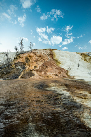 Bright Blue Sky Over Mammoth Hot Springs in Yellowstone National Parkの写真素材