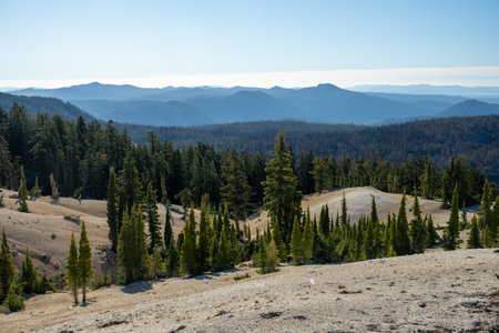 Pines Grow Sparsely In The Rocky HIlls In Lassen Volcanic National Parkの写真素材