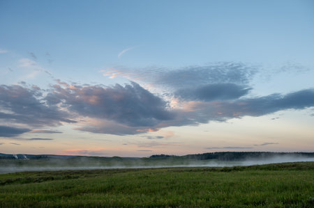 Fog Hangs In The Air Over The Yellowstone River in Hayden Valleyの写真素材